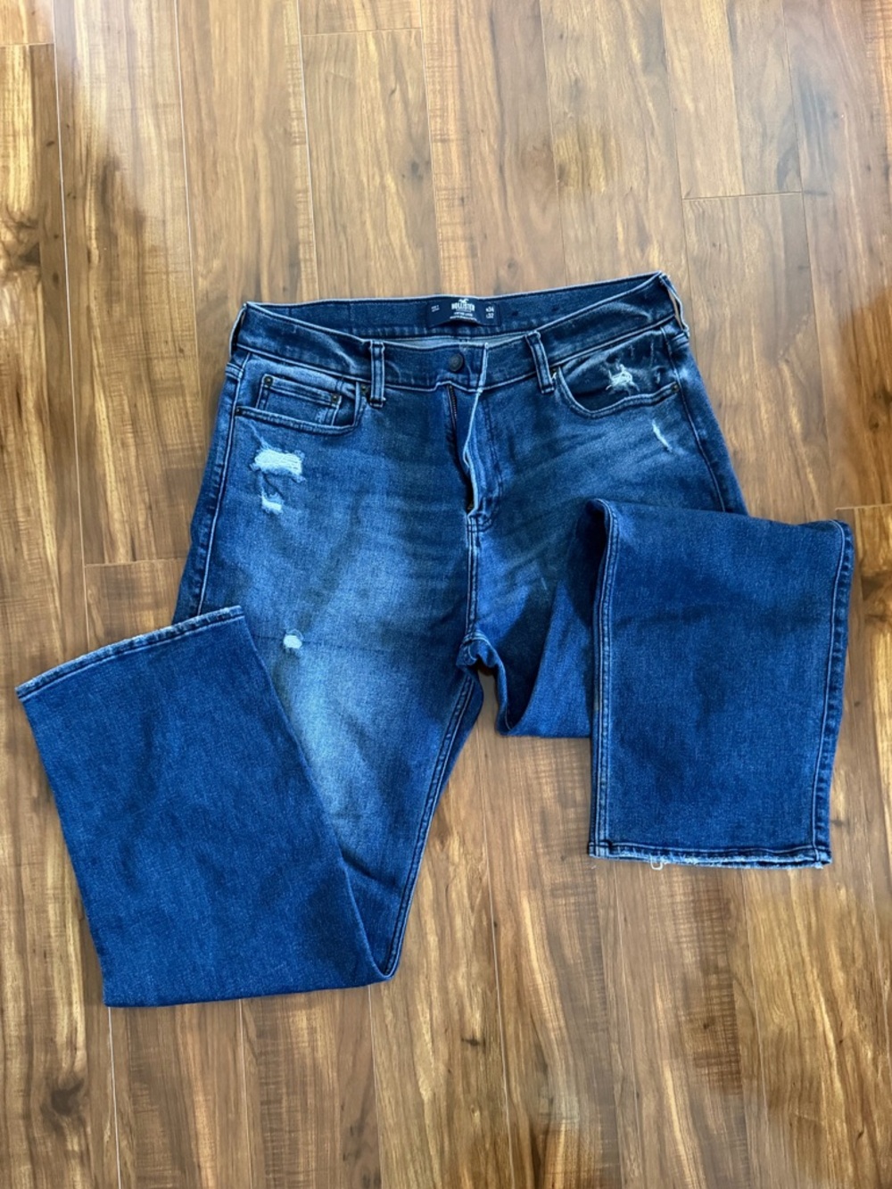 Hollister Men's Dark Blue Bootcut Jeans with Subtle Distressing